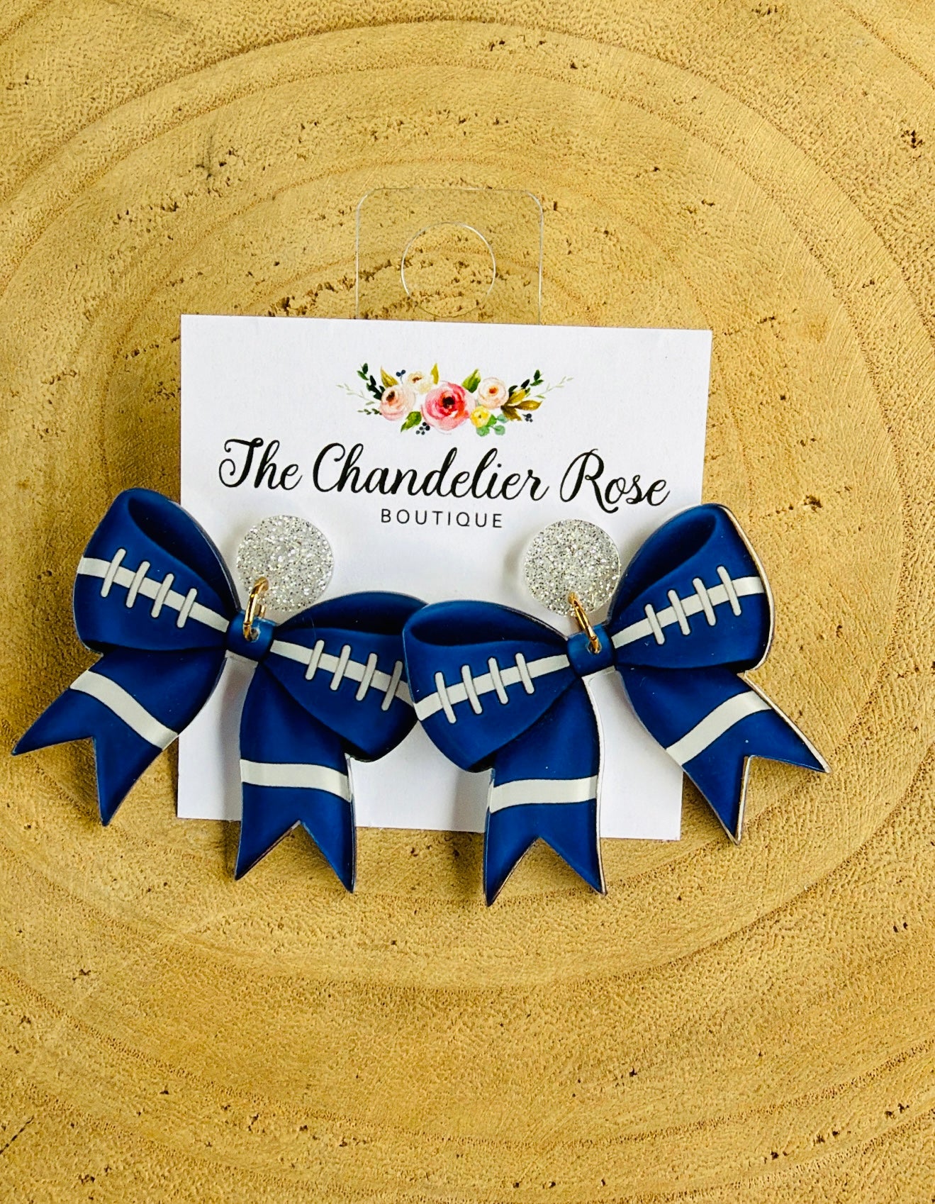 BLUE BOW FOOTBALL STITCH EARRINGS