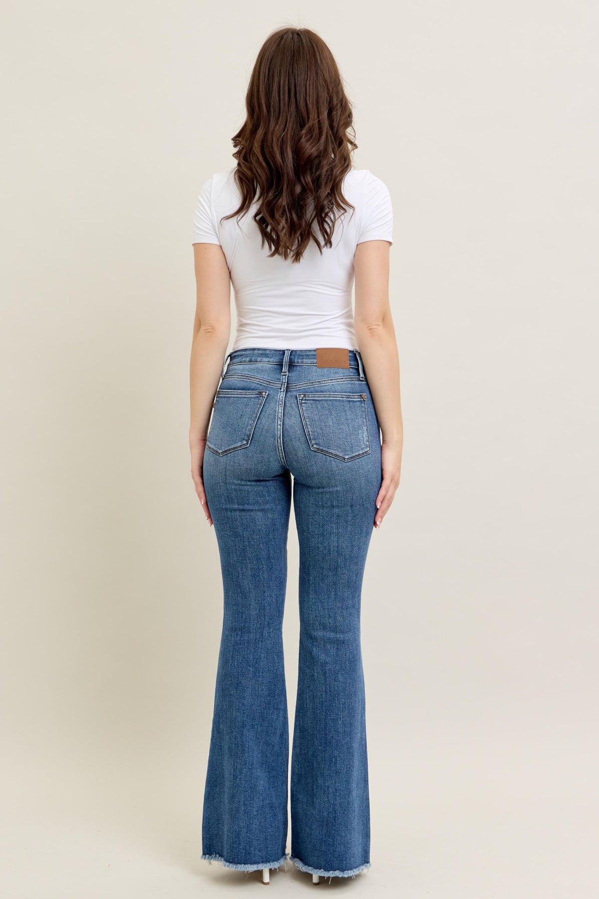 JUDY BLUE MID RISE VINTAGE WASH FLARE WITH DESTROY AND FAY HEM JEANS - MEDIUM STONE