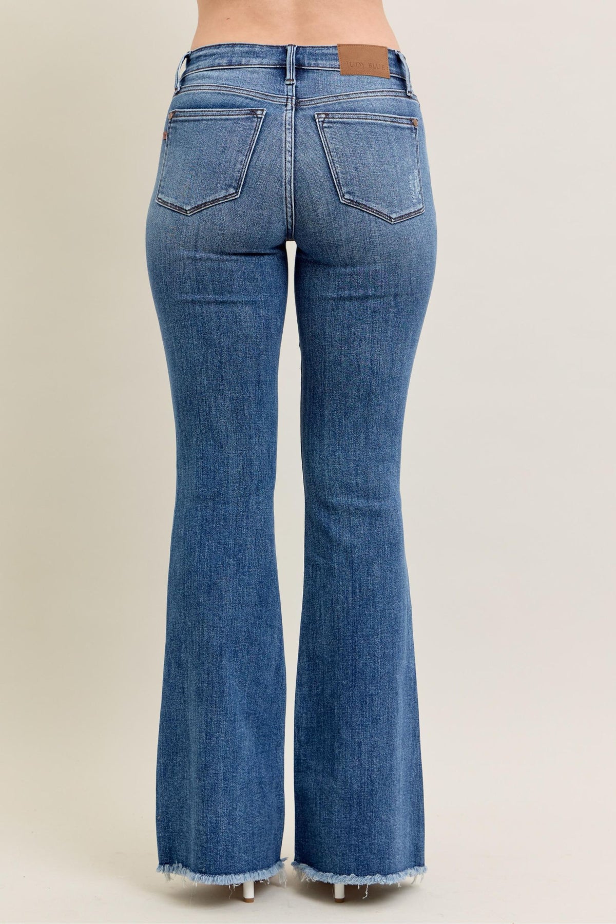 JUDY BLUE MID RISE VINTAGE WASH FLARE WITH DESTROY AND FAY HEM JEANS - MEDIUM STONE