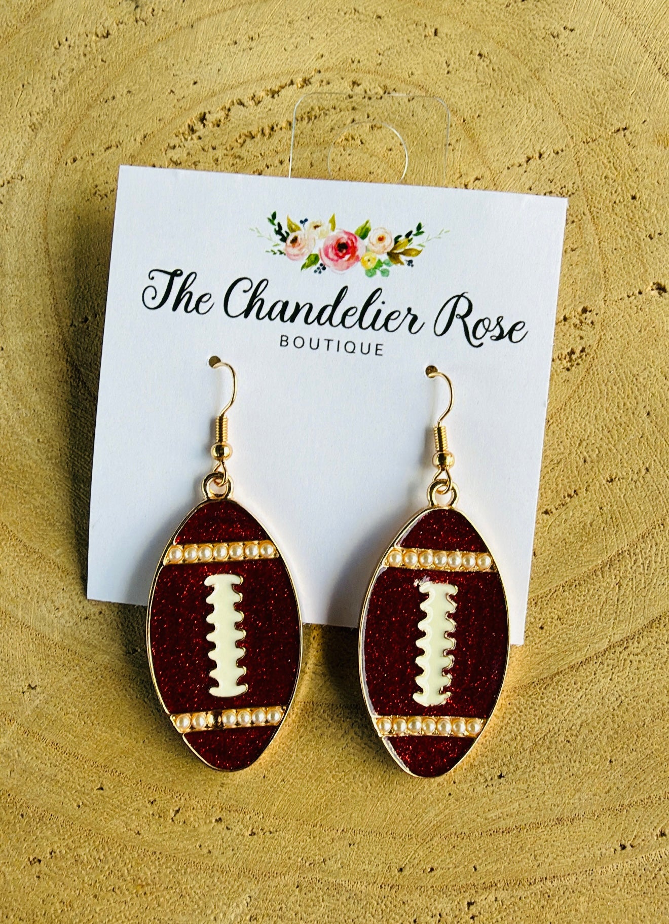 MAROON METAL FOOTBALL EARRINGS