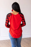 RED TOP WITH BUFFALO PLAID RAGLAN SLEEVES