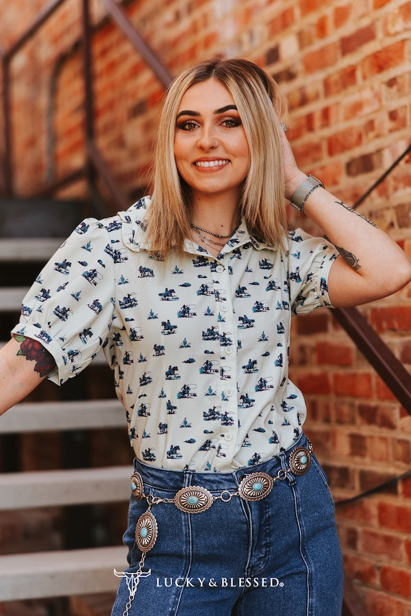 CREAM TEAL COWBOY PRINTED BUTTON DOWN PUFF SHORT SLEEVE TOP